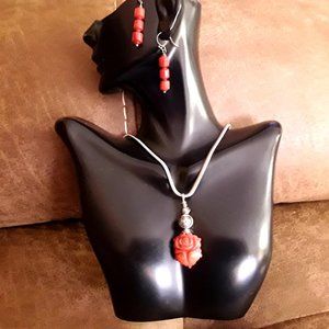 Red carved pendant on silver plated snake chain with earrings set.